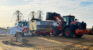 Loader filling large truck with quality sand